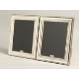 A LARGE PAIR OF SILVER PHOTOGRAPH FRAMES 8.5ins x 3.75ins