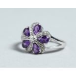 A SILVER, AMETHYST AND DIAMOND CLUSTER RING