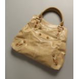 BALENCIAGA, PARIS, A LADIES BEIGE LEATHER HANDBAG.