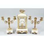 A LOUIS XVITH STYLE MARBLE AND GILT BRONZE MOUNTED CLOCK GARNITURE CIRCA. 1900. The four glass clock