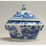 A STAFFORDSHIRE BLUE AND WHITE SHAPED TUREEN AND COVER, possibly Turner, circa. 1800. 5.5ins long.