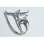 A SILVER ART DECO DANCER BROOCH.