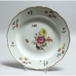 A 19TH CENTURY MEISSEN PORCELAIN PLATE, painted with flowers. Cross swords mark in blue 9.5ins