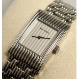 A BOUCHERON STEEL WRIST WATCH AND BRACELET. No. AK 416582.