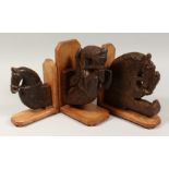 THREE CARVED WOOD MOUNTED HORSES' HEADS. 7.5ins (2) and 5.5ins.