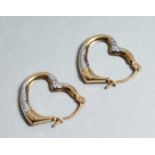 A PAIR OF 9CT GOLD HEART SHAPED EARRINGS.