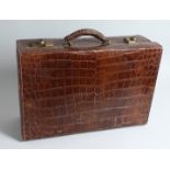 AN ARMY AND NAVY, LONDON, CROCODILE SUIT CASE. 19ins long x 12ins deep x 6ins high.