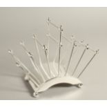 A CHRISTOPHER DRESSER SLVER PLATE SIX DIVISION TOAST RACK.