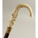 A BONE HANDLE WALKING STICK, ELEPHANT. 37ins long.