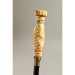 A BONE HANDLE WALKING STICK, CLASPED HANDS. 36ins long.