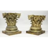 A GOOD PAIR OF LARGE CAST BRASS CORINTHIAN COLUMN CAPITALS, end standing on a square base with