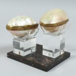 A PAIR OF PARIS MOTHER OF PEARL SHELLS on a stand.