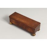 A NAPOLEONIC PRISIONER OF WAR PIQUET INLAID BOX with swivel top, on ball feet. 8ins high.