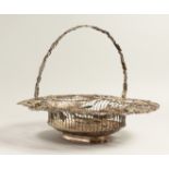 A GEORGE III SILVER WIRE WORK BASKET, oval with fruiting vines an wheat ears with pierced handles.