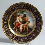 A VERY GOOD 19TH CENTURY VIENNA PLATE rich blue and gilt border with a scene painted Maleager und