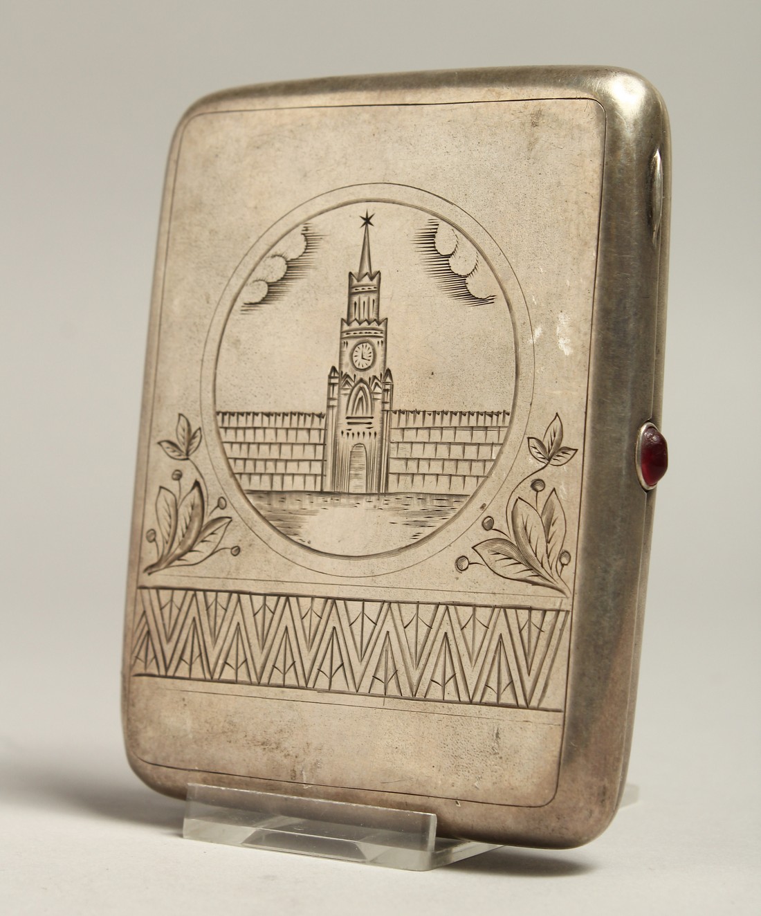 A RUSSIAN SILVER CIGARETTE CASE, the front engraved with a church. 4ins x 3ins