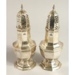 A PAIR OF HEXAGONAL SUGAR SIFTERS. Sheffield 1909, maker, Walker & Hall.