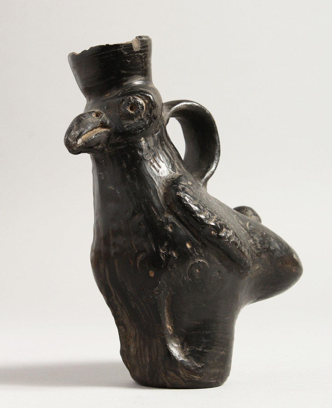 A SOUTH AMERICAN POTTERY BIRD JUG. 6.5ins high.