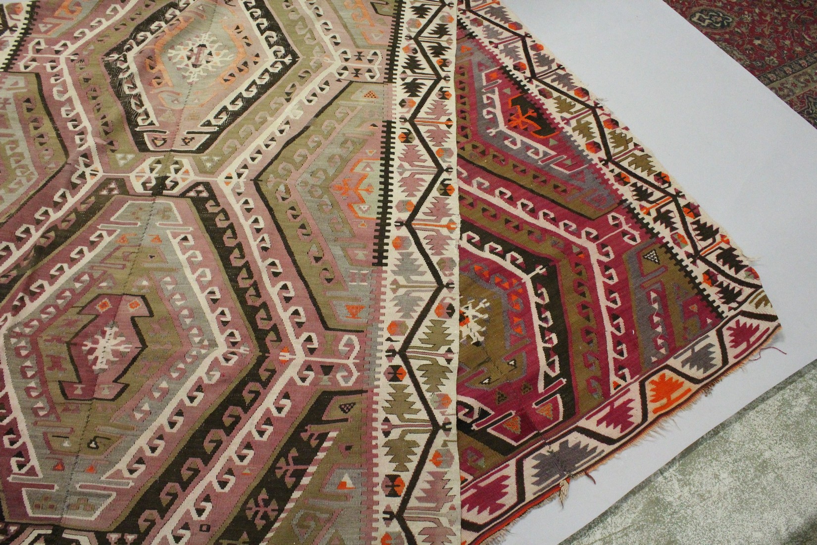 A TURKISH KELIM CARPET, with central join, pink ground with four large medallions. 12ft 6ins x 5ft. - Image 7 of 7