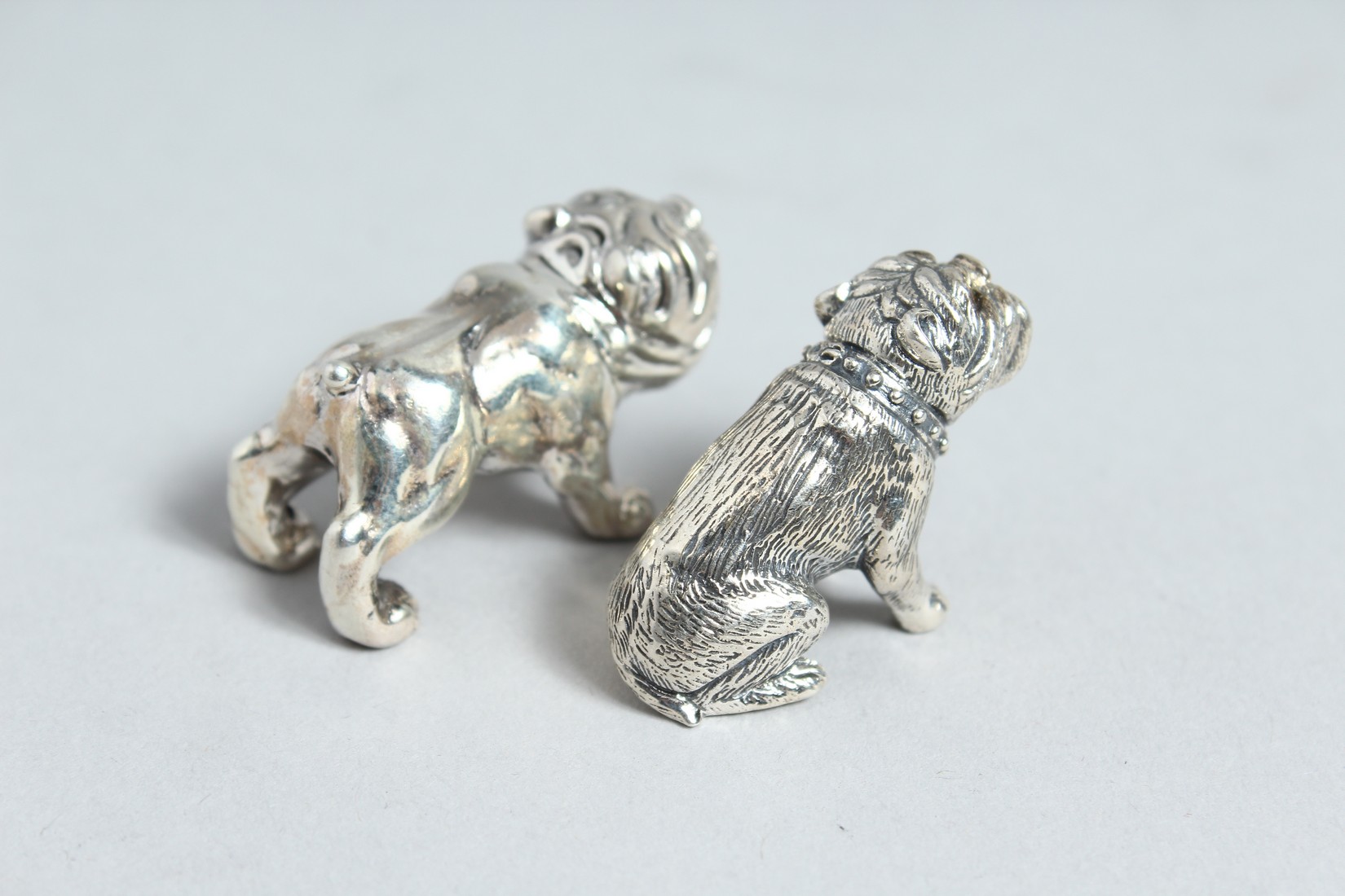 A SILVER PAIR OF CAST SILVER FIGURES OF DOGS. - Bild 3 aus 3