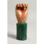 A CARVED WOOD AND PAINTED FOLK ART HAND. 7ins.