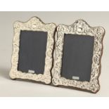 A PAIR OF SILVER REPOUSSE PHOTOGRAPH FRAMES 7.5ins x 5.5ins