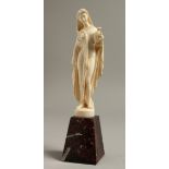 A GOOD EUROPEAN IVORY OF A CLASSICAL LADY holding an urn. 5.5ins high on a marble base.