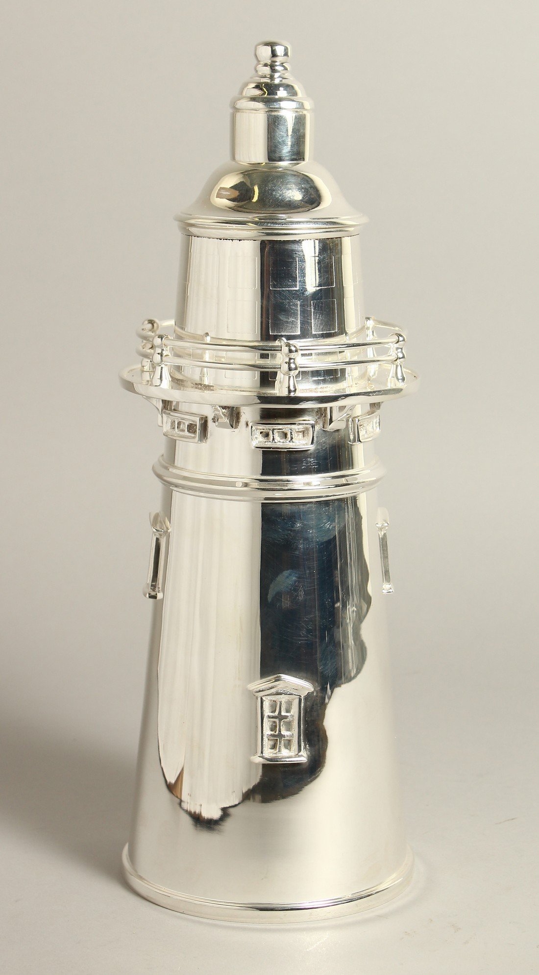 A SILVER PLATED LIGHTHOUSE COCKTAIL SHAKER