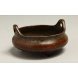 A SMALL CHINESE BRONZE TWO HANDLED CENSER 3ins diameter