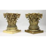 A GOOD PAIR OF LARGE CAST BRASS CORINTHIAN COLUMN CAPITALS, each standing on a square base with