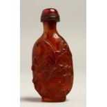 A CARVED AMBER SNUFF BOTTLE