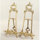 A PAIR OF BRASS PICTURE EASELS. 19ins long.