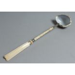 A COWIE SHELL PUNCH LADLE with ivory handle. 14ins long.