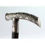 A JAPANESE SILVER-HANDLED WALKING STICK with Chinese design carved rosewood shaft. 35ins long
