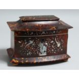 A GOOD REGENCY TORTOISESHELL SERPENTINE-FRONTED TWO-DIVISION TEA CADDY inlaid with mother of pearl