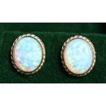 A PAIR OF 9CT. GOLD OPAL STUD EARRINGS