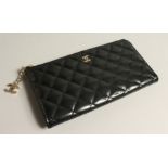 A LADIES BLACK PATENT LEATHER , QUILTED CLUTCH BAG, boxed.