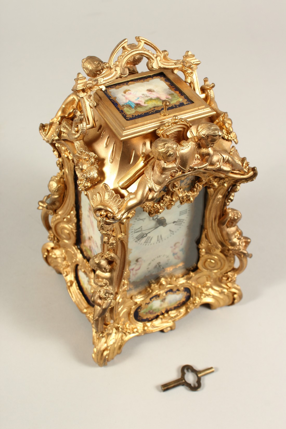A LARGE LOUIS XVITH STYLE SEVRES ORMOLLU CLOCK with painted porcelain panels, cupid mounts and - Bild 7 aus 7