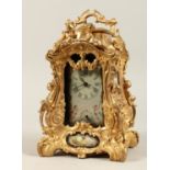 A LARGE LOUIS XVITH STYLE SEVRES ORMOLLU CLOCK with painted porcelain panels, cupid mounts and