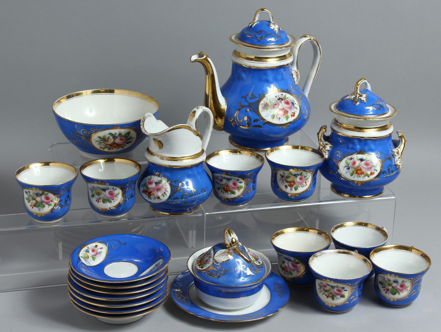 A CONTINENTAL BLUE GROUND PORCELAIN TEA SET comprising tea pot, sugar bowl, milk jug, bowl, bowl and