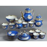 A CONTINENTAL BLUE GROUND PORCELAIN TEA SET comprising tea pot, sugar bowl, milk jug, bowl, bowl and
