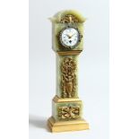 A FRENCH ONYX AND GILT BRONZE MINIATURE LONGCASE CLOCK, CIRCA. 1900 in a leather case.