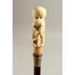 A BONE HANDLE WALKING STICK, OCTOPUS. 35ins long.