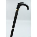 A VICTORIAN EBONY WALKING STICK 37ins long.