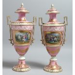 A VERY GOOD PAIR OF 19TH CENTURY SEVRES PORCELAIN TWO HANDLED URN SHAPED VASES AND COVERS, pink
