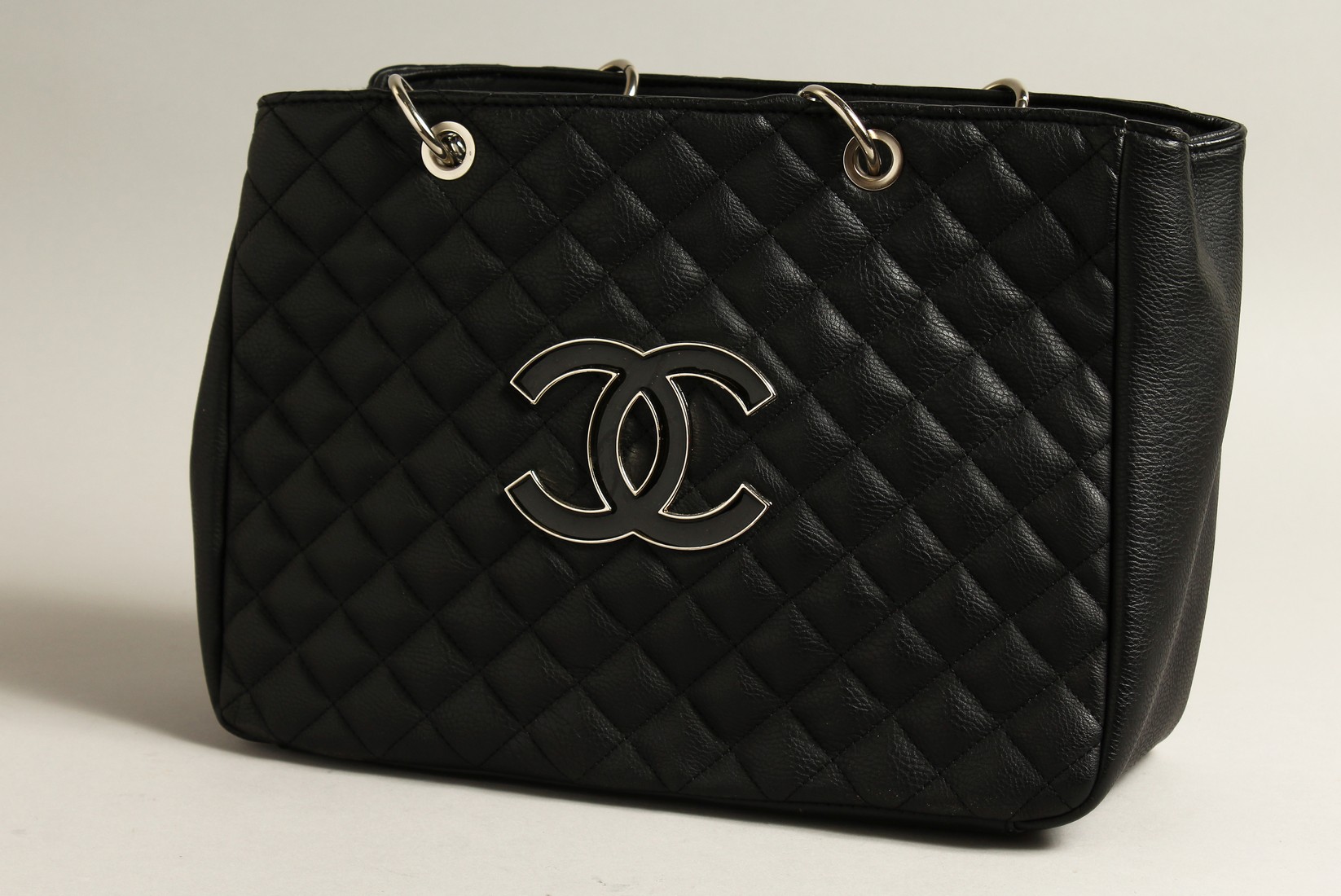 A CHANEL BLACK QUILTED LEATHER SHOULDER BAG.