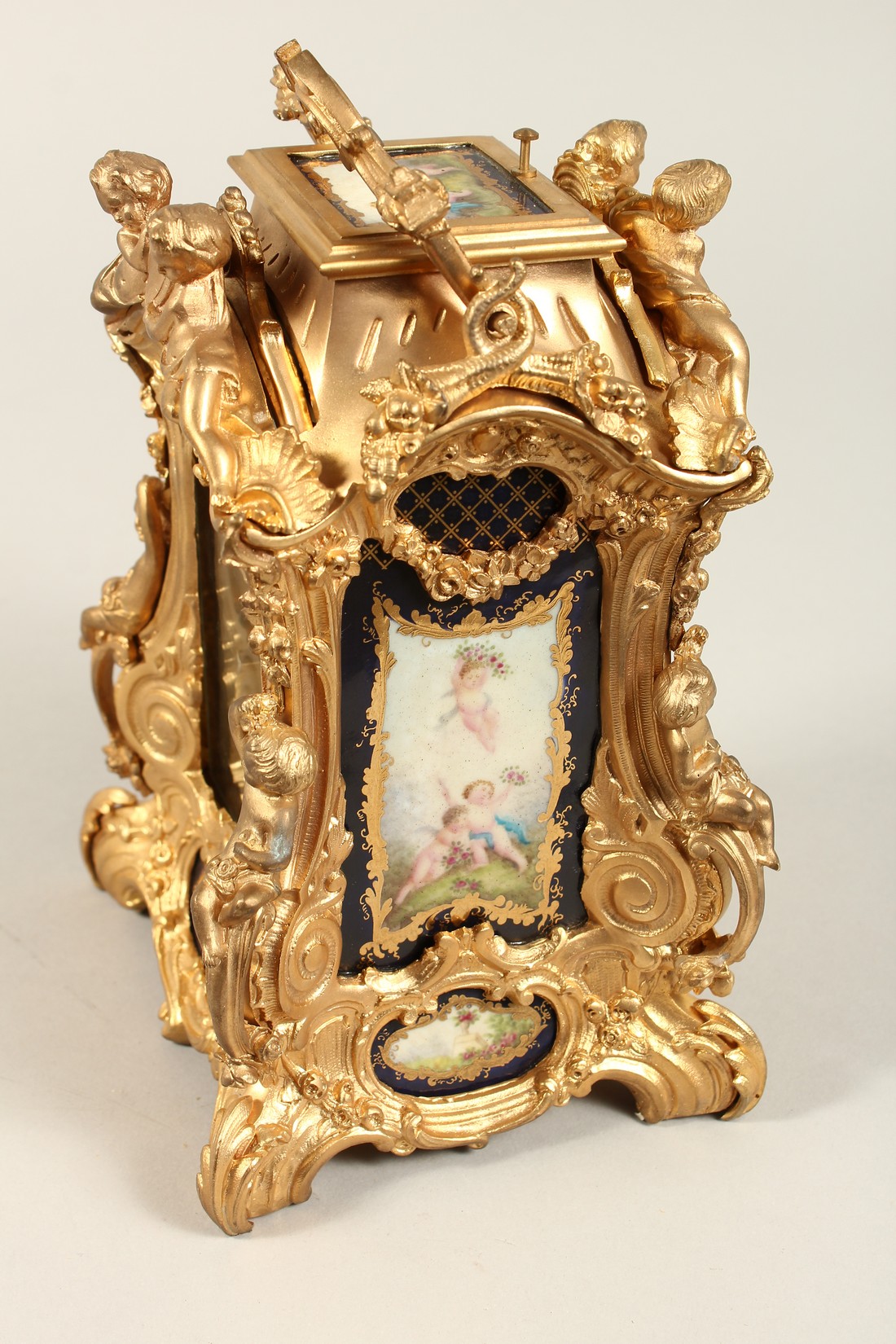 A LARGE LOUIS XVITH STYLE SEVRES ORMOLLU CLOCK with painted porcelain panels, cupid mounts and - Bild 5 aus 7