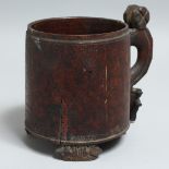 AN EARLY SCANDINAVIAN WOODEN TANKARD, old label on base. 5.5ins high.