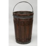 A VERY GOOD LARGE CARVED MAHOGANY 19TH CENTURY STYLE PEAT BUCKET, with metal liner. 26ins high.