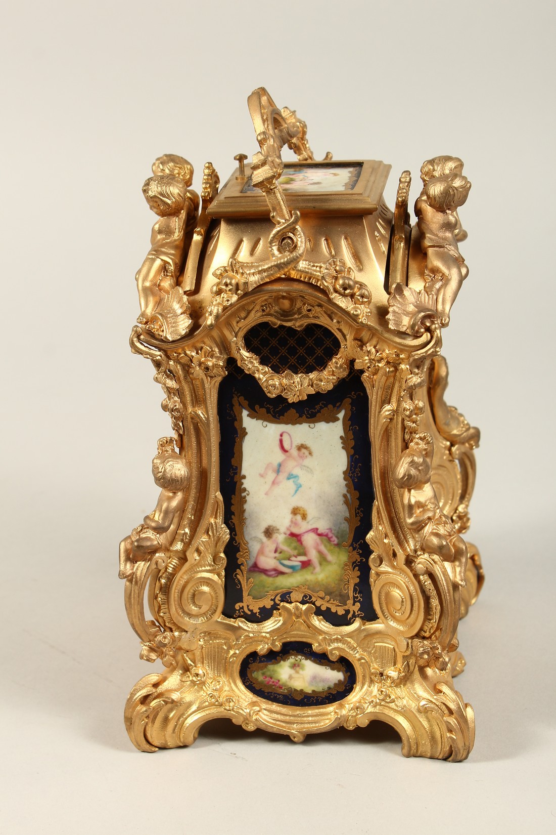 A LARGE LOUIS XVITH STYLE SEVRES ORMOLLU CLOCK with painted porcelain panels, cupid mounts and - Bild 2 aus 7